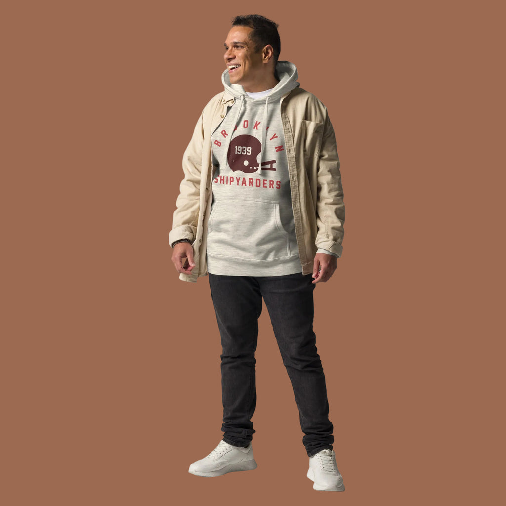 Vintage leather football helmet with "Brooklyn Shipyarders 1939", printed on a SodaPop Cool hoodie.