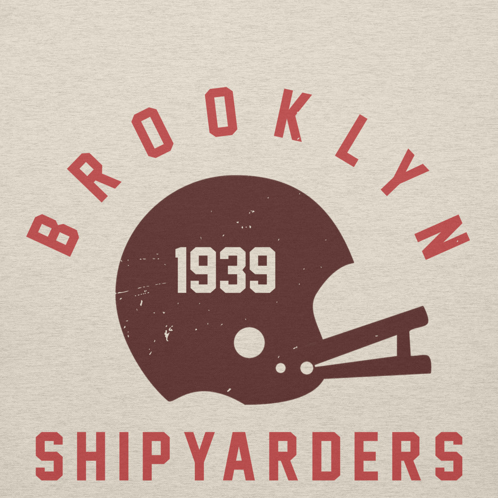 Vintage leather football helmet with "Brooklyn Shipyarders 1939", printed on a SodaPop Cool hoodie.