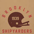 Vintage leather football helmet with "Brooklyn Shipyarders 1939", printed on a SodaPop Cool hoodie.