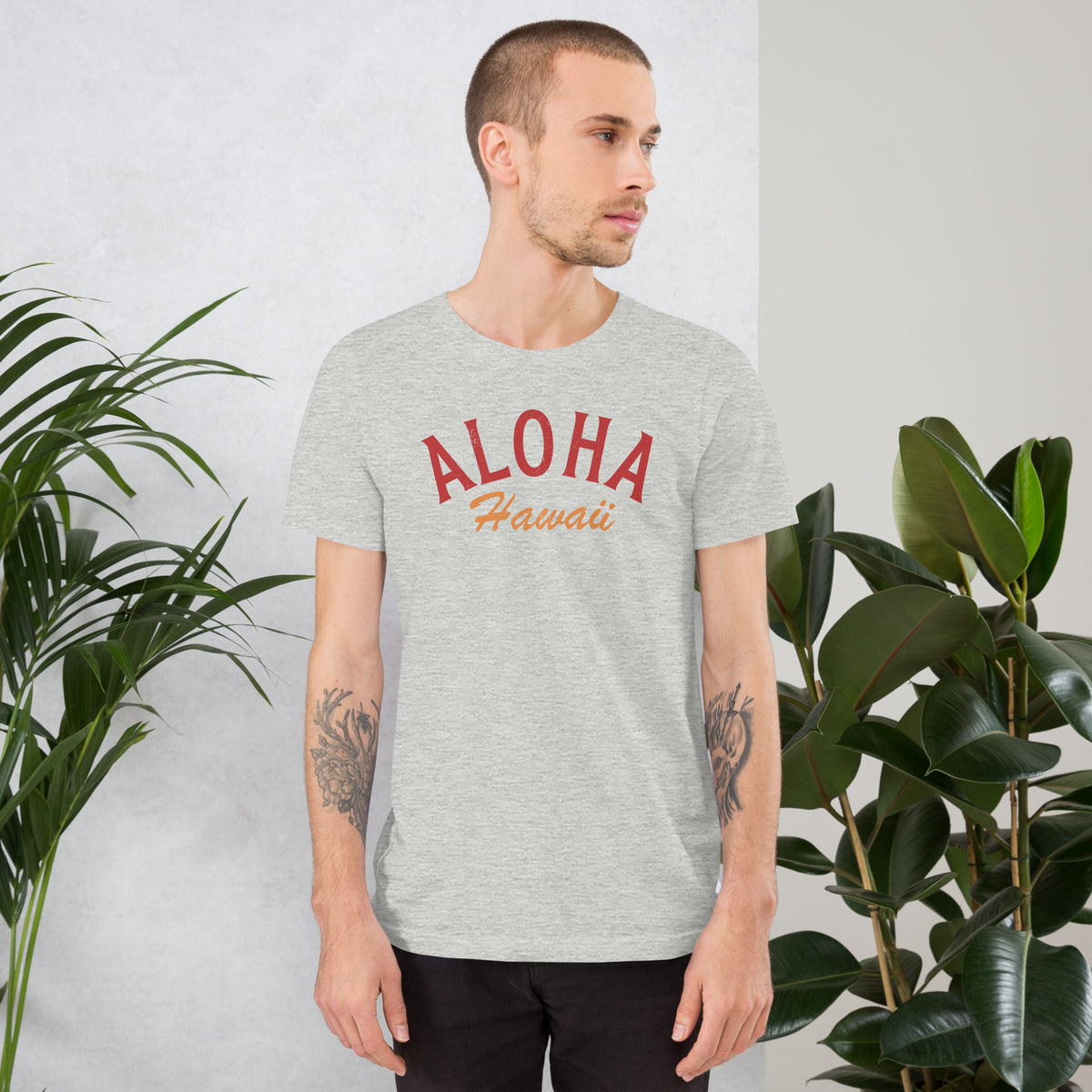 "Aloha Hawaii" in classic vintage island lettering, printed on a SodaPop Cool t-shirt.