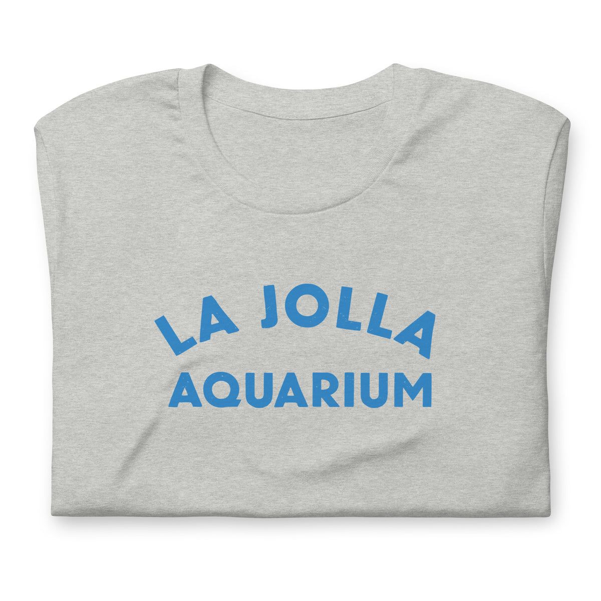 "La Jolla Aquarium" in classic vintage type, printed on a SodaPop Cool t-shirt.