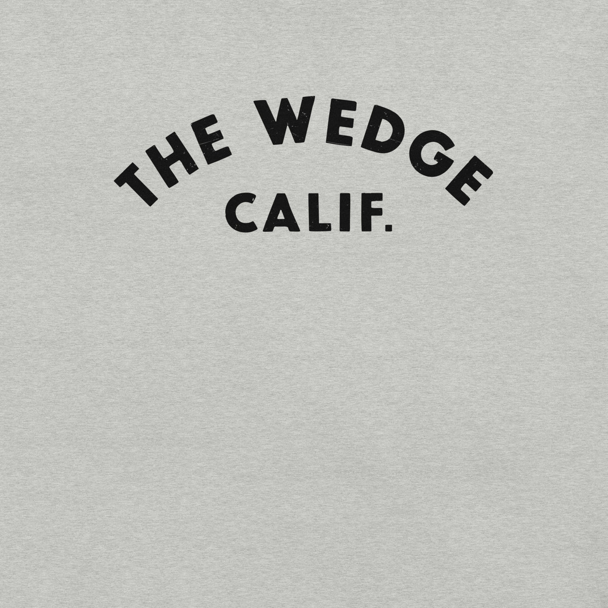 "The Wedge" in classic California surf lettering, printed on a SodaPop Cool t-shirt.