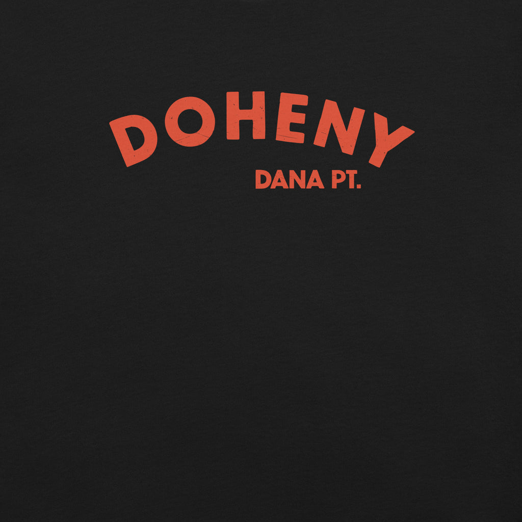 "Doheny Dana Point" in vintage California surf lettering, printed on a SodaPop Cool t-shirt.