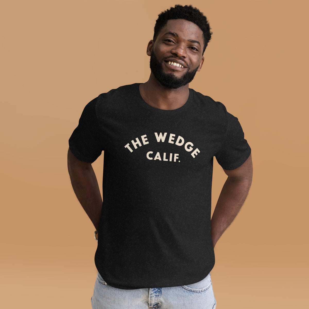 "The Wedge" in classic California surf lettering, printed on a SodaPop Cool t-shirt.