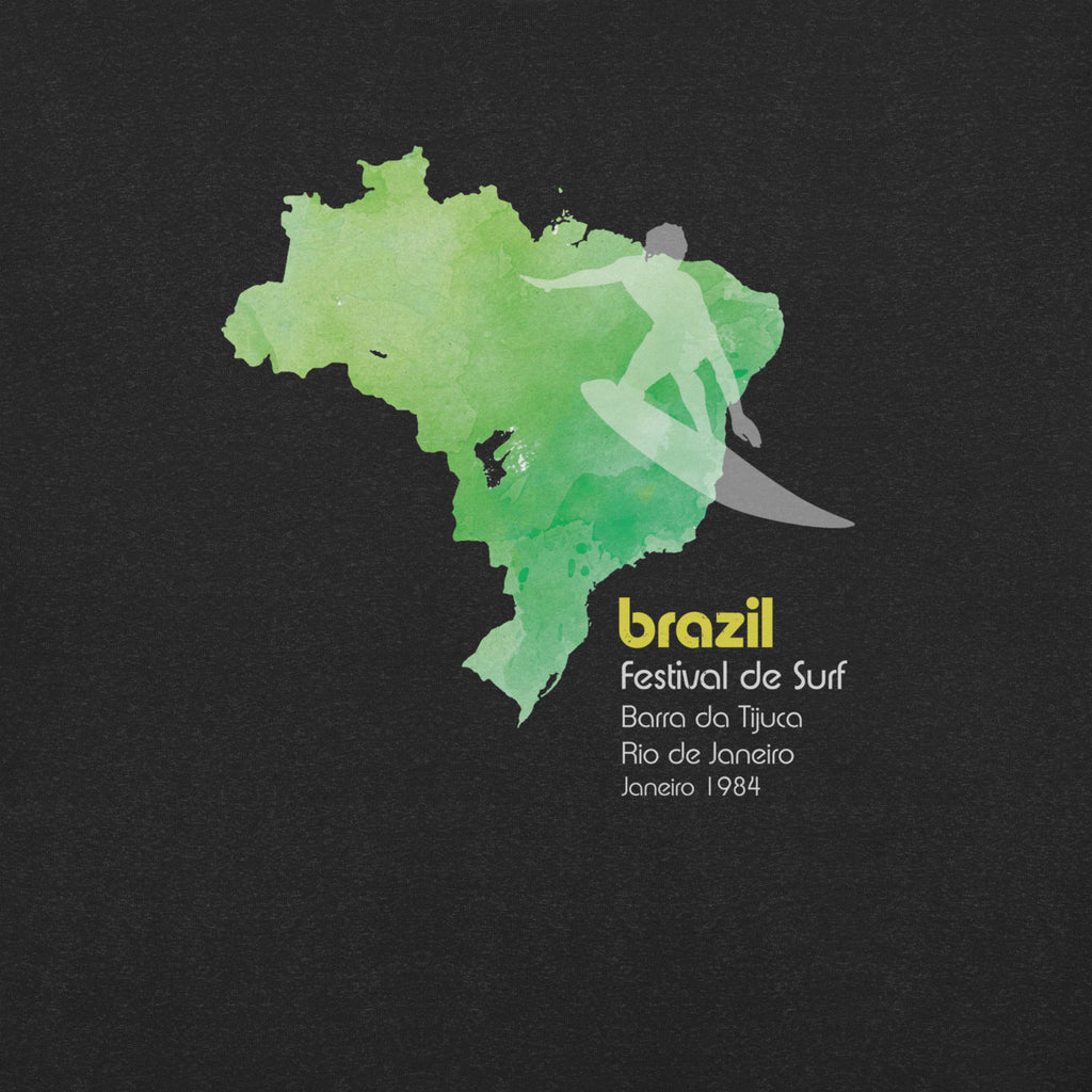Brazil country outline with a surfer figure and "1984", vintage surf festival poster styling, printed on a SodaPop Cool t-shirt.
