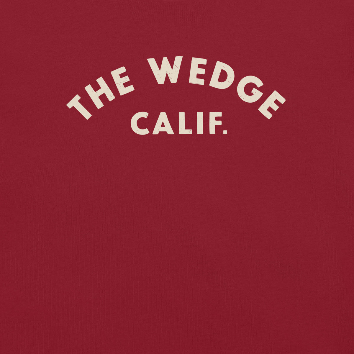 "The Wedge" in classic California surf lettering, printed on a SodaPop Cool t-shirt.