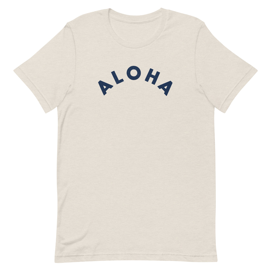 "Aloha" in clean vintage Hawaiian lettering, printed on a SodaPop Cool t-shirt.