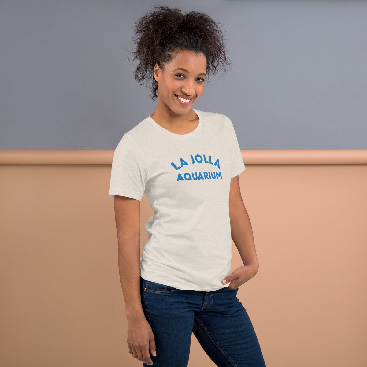 "La Jolla Aquarium" in classic vintage type, printed on a SodaPop Cool t-shirt.