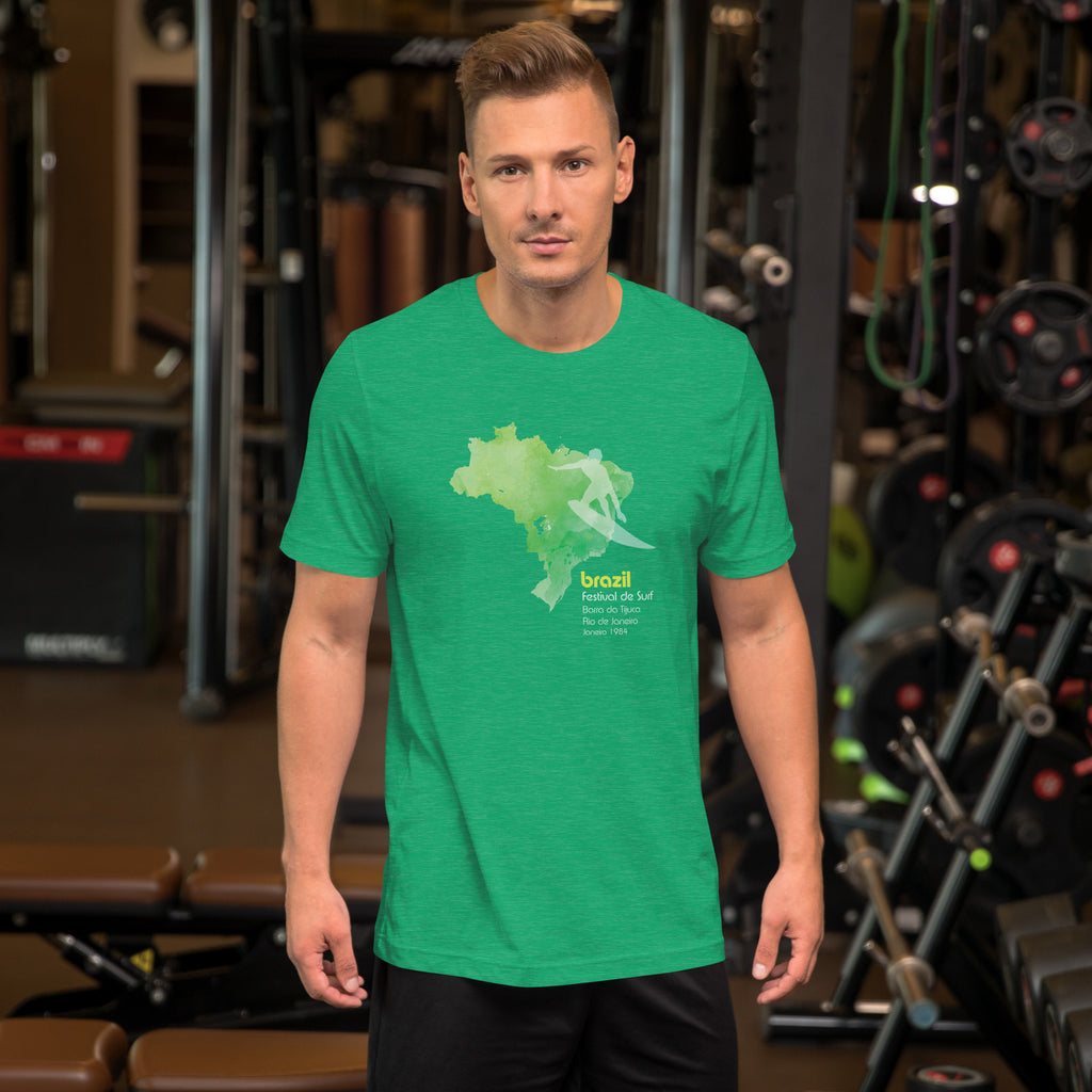 Brazil country outline with a surfer figure and "1984", vintage surf festival poster styling, printed on a SodaPop Cool t-shirt.