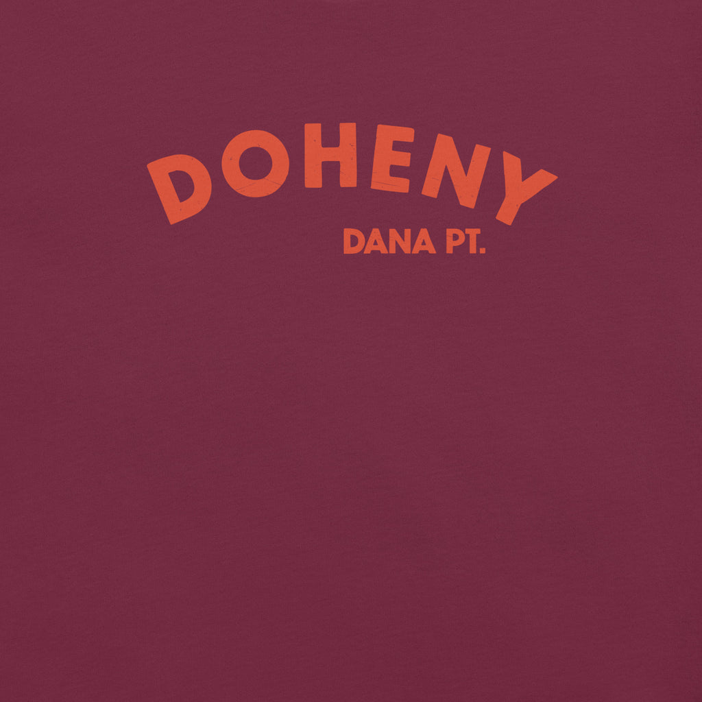 "Doheny Dana Point" in vintage California surf lettering, printed on a SodaPop Cool t-shirt.