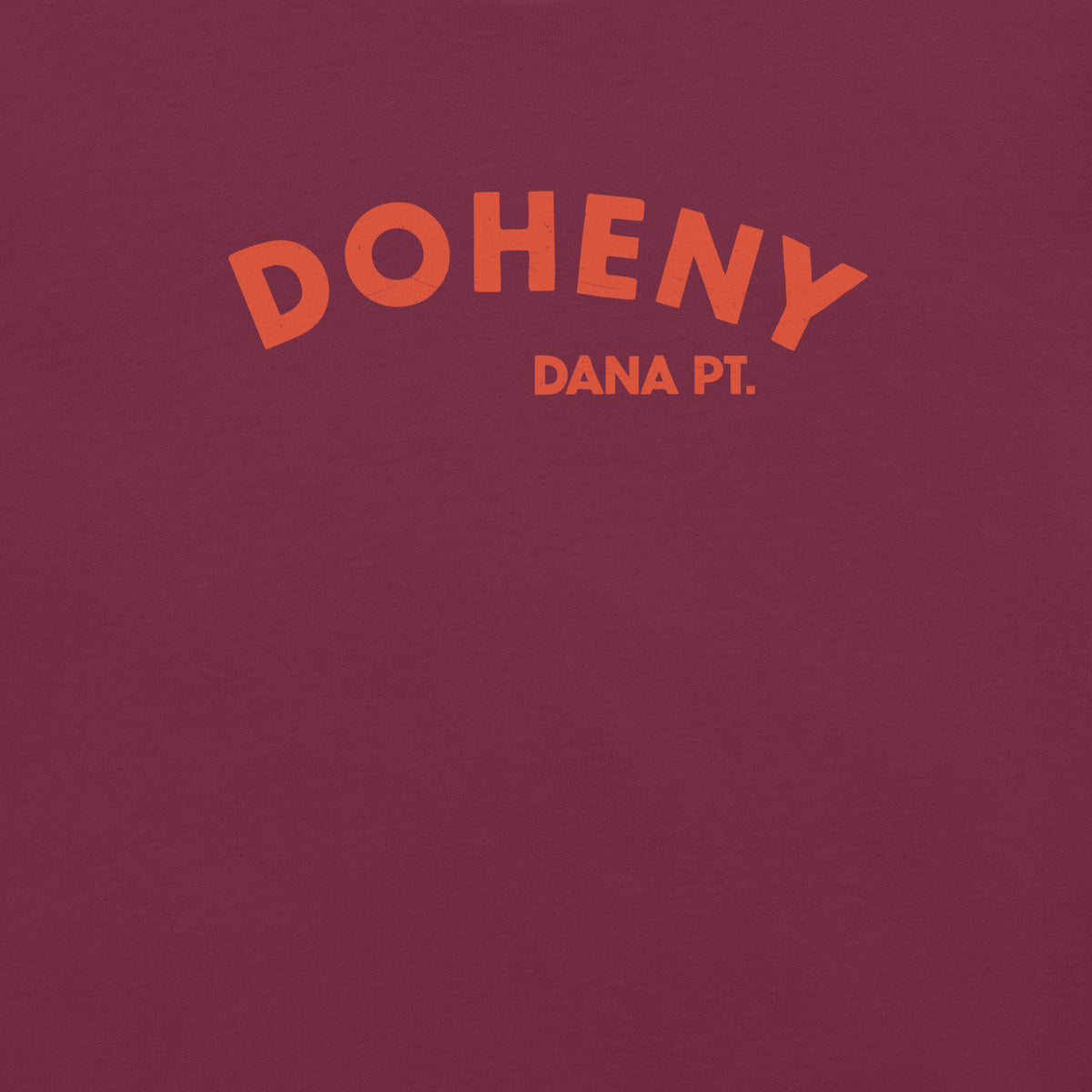 "Doheny Dana Point" in vintage California surf lettering, printed on a SodaPop Cool t-shirt.