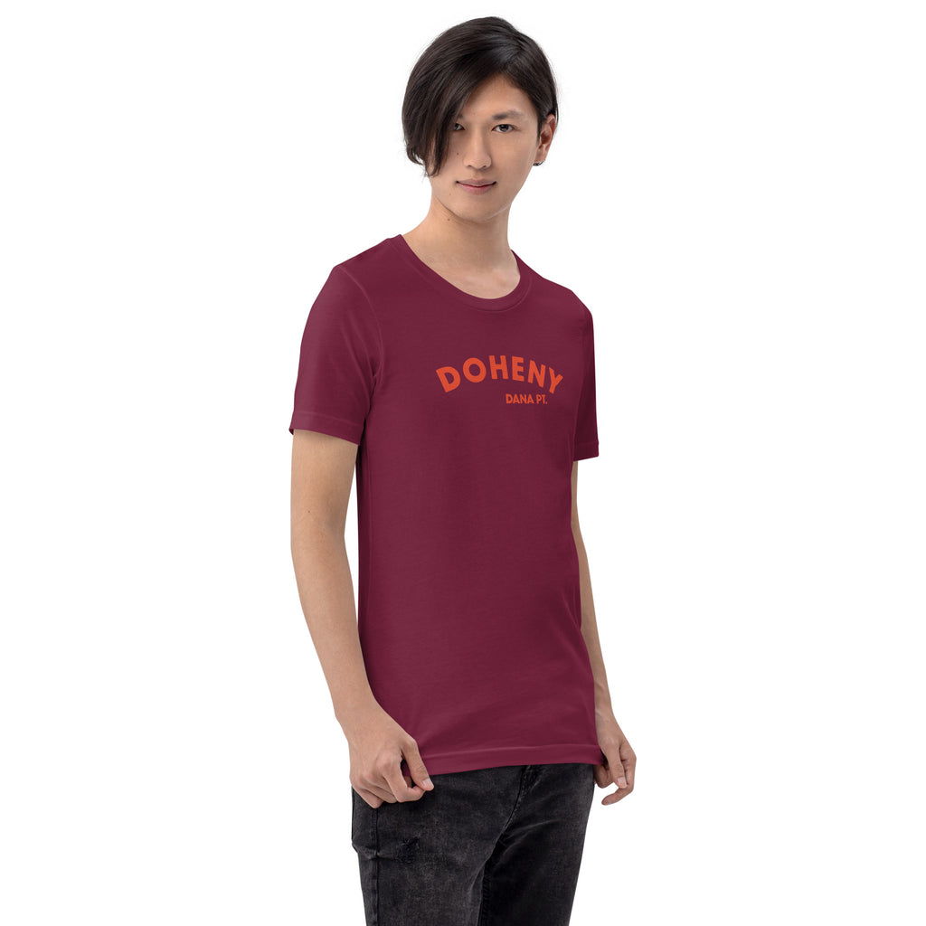 "Doheny Dana Point" in vintage California surf lettering, printed on a SodaPop Cool t-shirt.