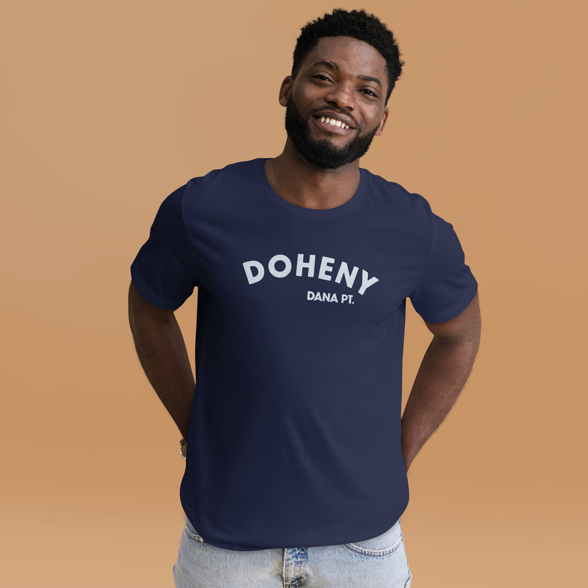 "Doheny Dana Point" in vintage California surf lettering, printed on a SodaPop Cool t-shirt.