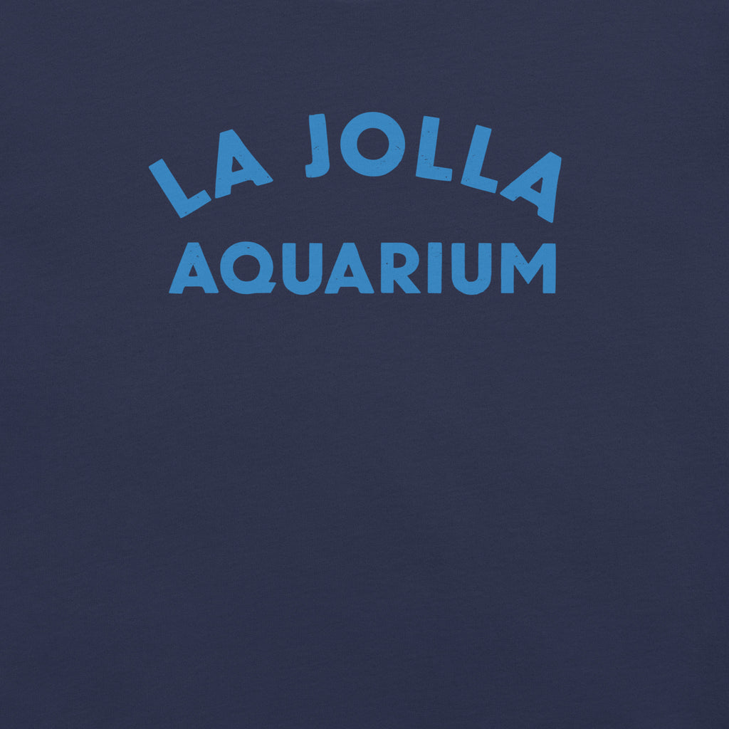 "La Jolla Aquarium" in classic vintage type, printed on a SodaPop Cool t-shirt.