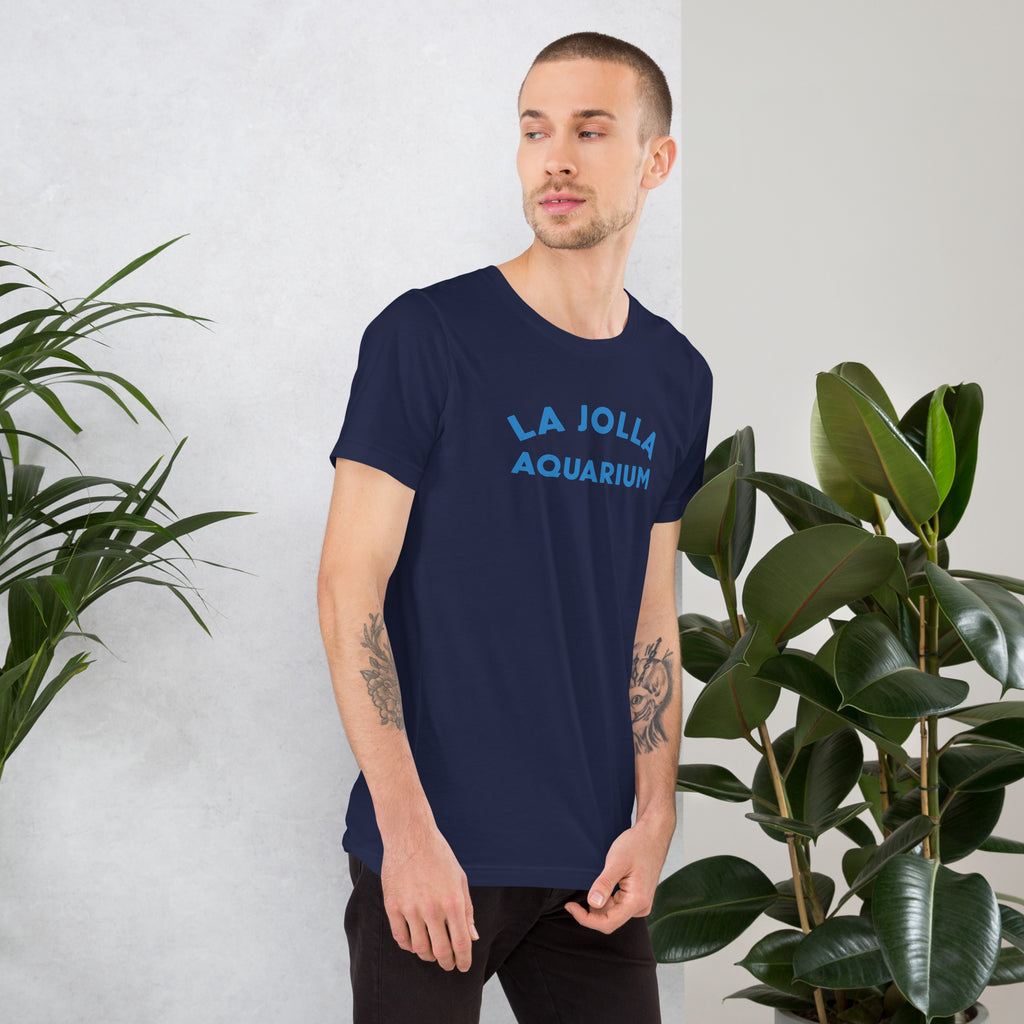"La Jolla Aquarium" in classic vintage type, printed on a SodaPop Cool t-shirt.