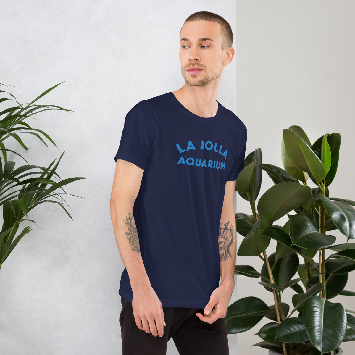 "La Jolla Aquarium" in classic vintage type, printed on a SodaPop Cool t-shirt.