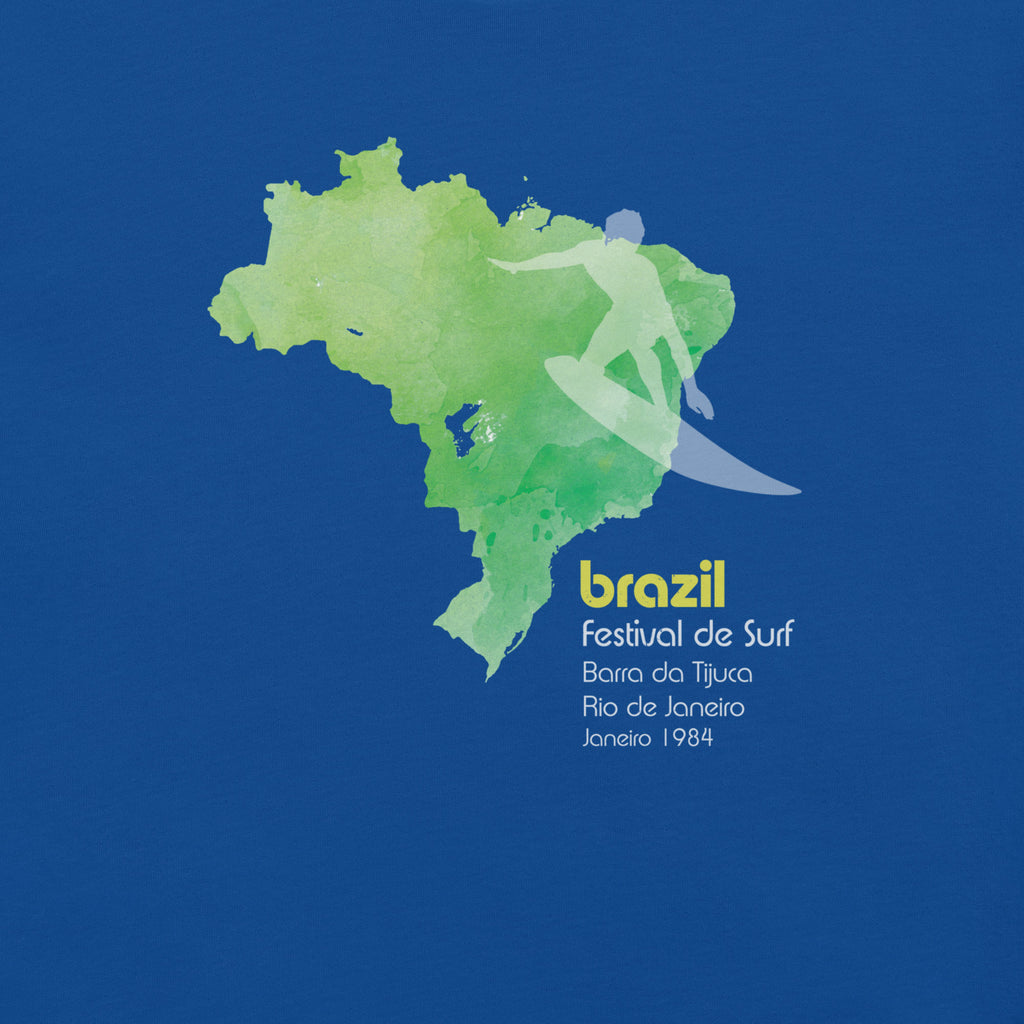 Brazil country outline with a surfer figure and "1984", vintage surf festival poster styling, printed on a SodaPop Cool t-shirt.