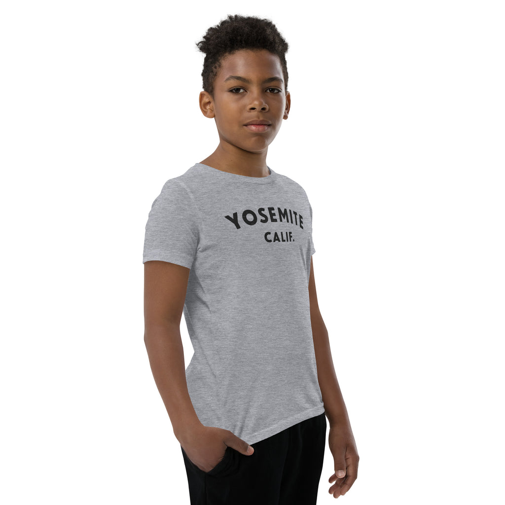 "Yosemite National Park" in vintage park-service lettering, printed on a SodaPop Cool kids t-shirt.