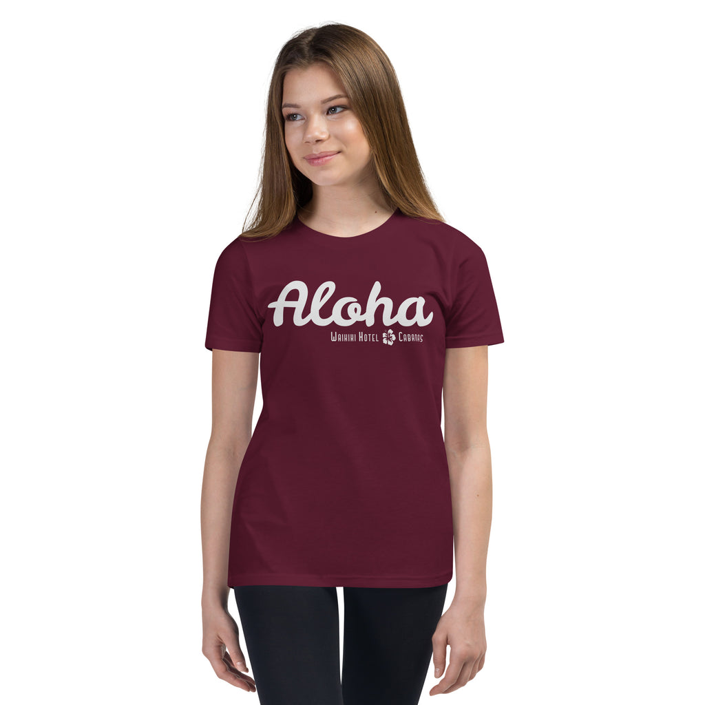 "Waikiki Hotel &amp; Cabanas" in vintage Hawaiian resort lettering, printed on a SodaPop Cool kids t-shirt.