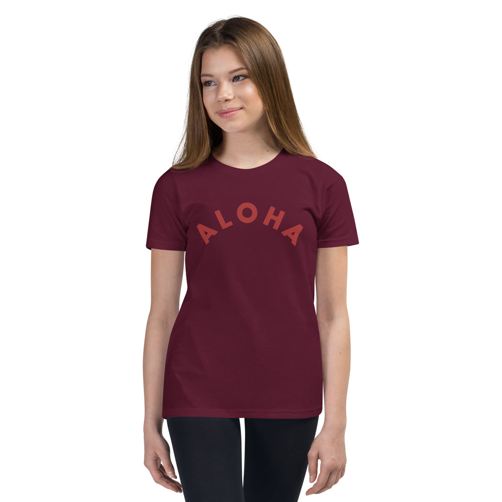 "Aloha" in clean vintage Hawaiian lettering, printed on a SodaPop Cool kids t-shirt.